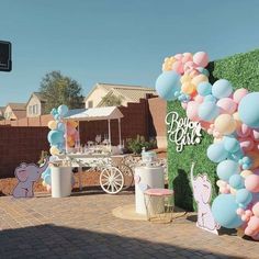 an outdoor birthday party with balloons and decorations