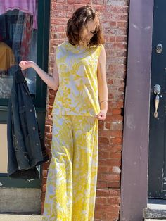 "1960s vintage yellow and white hummingbird print cotton beach pajamas to die for. Super wide leg high waist pant and sleeveless tunic length top in heavy duty cotton weave with screen print. So sunny and bright! In good vintage condition with no serious flaws of note. Some light spots that are not noticeable among the yellow print. Feel free to request detailed photos. Back metal zipper, snap and hook and eye closures. Tags Made by Beachcomber Jamaica W.I. Hand Screened Print Hand Wash Only Do Yellow Casual Sets With Floral Print, Casual Yellow Sets With Floral Print, Yellow Sets For Summer Daywear, Yellow Summer Daywear Sets, Yellow Sets For Daywear In Spring, Yellow Casual Floral Print Sets, Casual Yellow Floral Print Sets, Yellow Printed Hawaiian Tops, Retro Yellow Beach Top