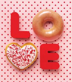 two donuts and a heart shaped doughnut on a polka dot background with the word love spelled out