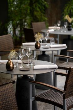 an outdoor dining area with tables and chairs