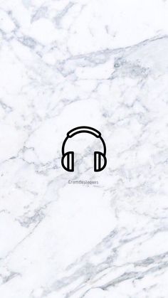 the headphones are black and white in color on marble background with text that says, listen to music