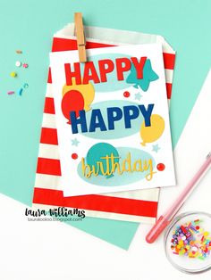 a happy birthday card with confetti and sprinkles next to it