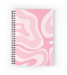 a spiral notebook with pink and white swirls