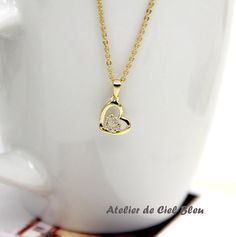 Double Heart Necklace by AtelierdeCielBleu Heart Pendant Necklace For Wedding Gift, Elegant Heart Necklace For Bridesmaid Gift On Valentine's Day, Gold Double Heart Necklace For Gifts, Yellow Gold Double Heart Necklace Gift, Elegant Heart Necklace For Bridesmaid Or Valentine's Day, Elegant Heart Necklace For Bridesmaid Gift, Elegant Yellow Gold Double Heart Necklace, Elegant Heart Necklace As Bridesmaid Gift, Gold Plated Double Heart Necklace