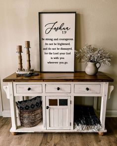 a white table with a sign above it