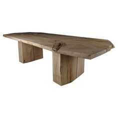 a large wooden table with two legs and a piece of wood sticking out of it