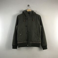 PLEASE READ DESCRIPTION BELOW BEFORE BUYING👇🏻 *ITEM:Vintage Beams Army Jacket *ITEM DETAILS: 👇🏻 Please be aware that all vintage items will usually show a few signs of wear or fading due to age, but anything visible such as stains or holes, and serious flaws have been photographed.For any further information on this item please contact us and we will be happy to help. *SIZE:MEDIUM *ACTUAL SIZE MEASUREMENT: 👇🏻 *PIT TO PIT(WIDTH):22"INCHES *LENGTH(FROM SHOULDER): 26"INCHES 17&25  *ALL MEASUREMENTS ARE TAKEN WITH THE GARMENT FLAT ON THE GROUND *VIEW FULL SHOP HERE: https://www.etsy.com/shop/Tracstore *SHIPPING: (WITH ONLINE TRACKING NUMBER ) *DHL EXPRESS SHIPPING:4-6 BUSINESS DAYS *Don't Worry About Customs Tax or Fees. I usually Declare As 'Gifts' And Low Value  *ANY QUESTION WILL ANSW Urban Cotton Windbreaker For Outdoor, Vintage Windbreaker With Detachable Hood, Vintage Windbreaker With Detachable Hood For Outdoor, Casual Khaki Windbreaker With Double-lined Hood, Sporty Cotton Khaki Outerwear, Sporty Khaki Cotton Outerwear, Vintage Outerwear With Detachable Hood For Outdoor Activities, Retro Hooded Windbreaker For Fall, Retro Hooded Fall Windbreaker