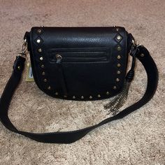 Great American Leatherworks Black Leather Bronze Studded Satchel Shoulder Bag 8.5"H X 9.5"W X 3.5"D Magnetic Snap Closure -- Removable Strap Outer-- Front Zipper Pocket, Back Pocket W/ Magnetic Snap Closure Inner-- 1 Zipper Pocket, 2 Media Pockets Comes With Adorable Chain Tassel Brand New With Tags & Beautiful! Black Faux Leather Crossbody Satchel, Black Bags With Gold-tone Hardware, Black Bags With Metal Hardware For Fall, Black Shoulder Bag With Metal Hardware For Fall, Black Crossbody Satchel With Metal Hardware, Fall Shoulder Bag With Branded Hardware In Black, Black Bags With Branded Hardware For Fall, Black Shoulder Bag With Branded Hardware For Fall, Black Crossbody Satchel