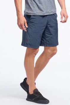 For gear that can keep up with your toughest workouts, add the 9" Unlined Workout Shorts by Rhone to your workout wardrobe. This relaxed fit short features a Navy color, with two front pockets, and an elastic waistband, boasting classic style for in and out of the gym. Lining in shorts provide comfort and a wider range of motion, while the lightweight performance fabric offers moisture wicking and quick drying. Wear this short for gym sessions, outdoor workouts, and more! Get the Deets: Relaxed Workout Wardrobe, Outdoor Workouts, Performance Fabric, Range Of Motion, Navy Color, Keep Up, Workout Shorts, Cargo Shorts, Moisture Wicking