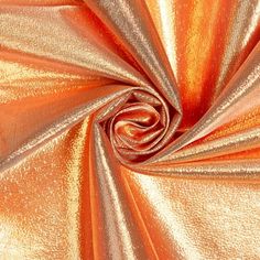 an orange and gold metallic fabric