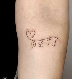 a small tattoo on the leg of a man that says love and is written in cursive letters