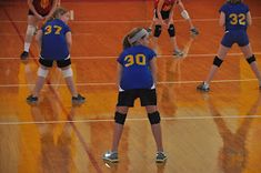 the volleyball players are playing on the court for their team's next match against each other