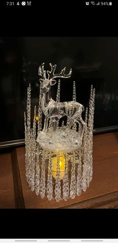 a glass crown with an image of a reindeer on it