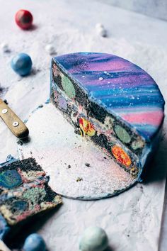 a colorful cake sitting on top of a table