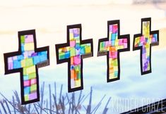 stained glass crosses are hanging on the window