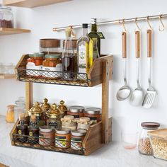 the shelves in the kitchen are filled with spices and condiments