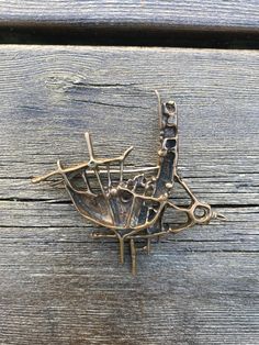 "Juhls Jewellry, Norwegian Modernist Bronze Brooch \"Tundra\" by Frank and Regine Juhls, Brutalist Style, Sculptural Jewelry, 1960s Norway Modern Sami  design.  In the 1950s, in Kautokeino, a young Danish handyman Frank Juhls met a young German girl Regine, who had taken a job as a maid with a reindeer herding family. Kautokeino was an isolated community in north of Norway, with no roads, where the Sami people still lived their traditional way of life.  The adventure began when Frank decided to repair Sami silver jewelry. This solid collectible item has  designers stamp.  Very Good Vintage condition Size approximately  L - 6.5cm (2.55\") H - 7cm (2.75\")" Brutalist Earrings, Bronze Jewellery, Sami People, Brutalist Jewelry, Unique Shelves, Sculptural Jewelry, German Girl, Modernist Jewelry, Bronze Jewelry