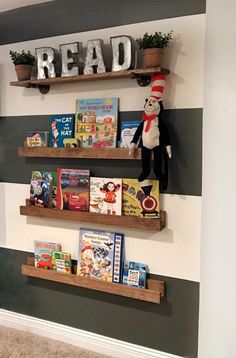 two shelves with books on them and a cat in the hat reading sign above it