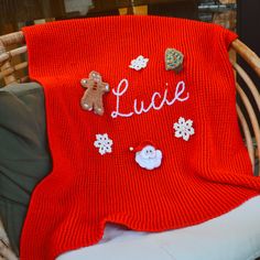 a knitted blanket sitting on top of a chair