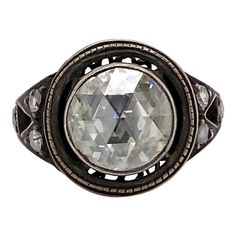 Vintage Victorian style rose cut diamond ring. Center round rose cut diamond, approximately 3.25ct but faces up like a 4ct diamond. Approximately I/J color and VS clarity. Complimented by 6 round cut diamonds approximately 0.12ct, H/I color and SI clarity. Bezel set, silver. Accommodated with an up-to-date appraisal by a GIA G.G. once purchased, upon request. Please contact us with any questions. Item Number R9267 Center Rouse Cut Diamond = Approximately 3.25ct, I/J color and VS clarity Side 6 R Rose Cut Diamond Ring, Brilliant Cut Diamond Ring, Vintage Cocktail Ring, Rosecut Diamond Ring, Platinum Diamond Rings, Gold Cocktail Ring, Unusual Jewelry, Gem Ring, Platinum Ring