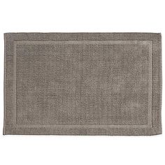 a gray bath mat on a white background