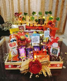 a basket filled with lots of different types of candy and candies on top of a table