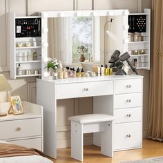 a white vanity with lights on it in a bedroom next to a bed and dresser