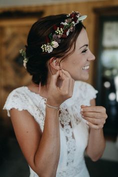 a woman wearing a flower crown in her hair