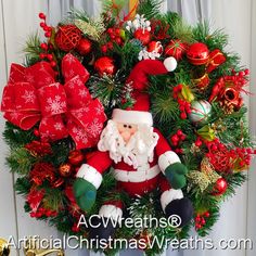 a christmas wreath with santa claus on it