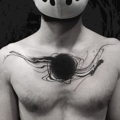 a shirtless man with a mask on his face