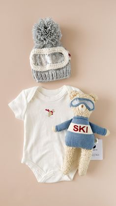 Put on your ski gear and join Benjamin Bear down the Frosty Mountains! He hits the slopes early for the fluffiest snow, and always makes sure to take hot coco breaks. Gift together with the matching blanket, sweater, and beanie. • Designed in Salt Lake City• 14" tall• 100% Organic Cotton, exclusive of trim• Recycled Polyester Fill Frosty Mountains, 1st Birthday Boy Themes, Baby Skiing, First Birthday Winter, Gender Neutral Clothes, Baby Mittens, Hot Coco, Blanket Sweater, Clock Gift