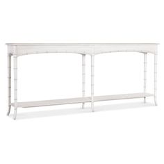 a white console table with two shelves