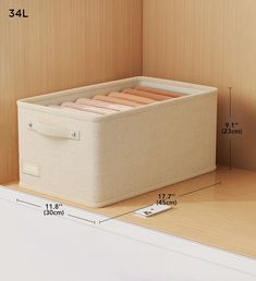 the storage box is labeled with measurements for each item in front of it and on the bottom shelf