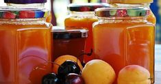 several jars filled with different types of fruit