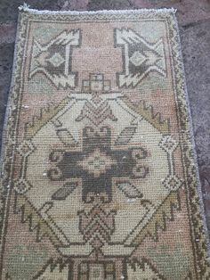 an old rug is laying on the ground