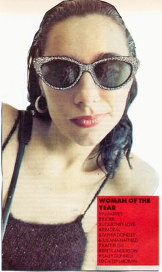 a woman with sunglasses on top of her head and the words woman of the year