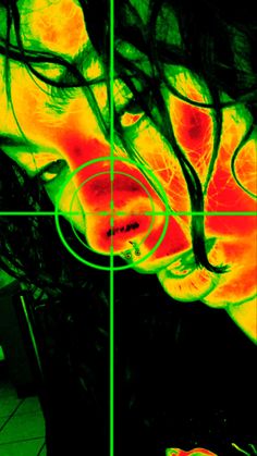 a woman's face is shown in an infrared image