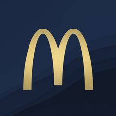 a golden mcdonalds logo on a dark blue background