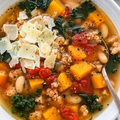 a white bowl filled with soup and vegetables