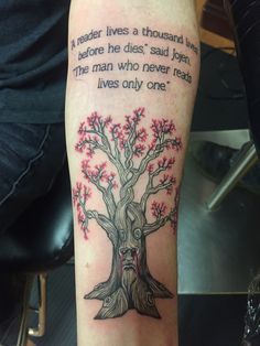 a man with a tree tattoo on his arm that reads, reader lives a thousand lives before he dies said john the man who never leaves only one