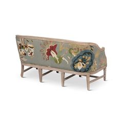 an old bench with floral designs on it