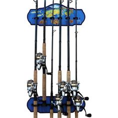 four fishing rods are attached to the back of a blue and white wall mounted rack