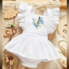 White Romper With Ruffled Straps And Skirt. It Has Embroidered Floral Design In Front. New In Package Toddler Jumpsuit Summer White Embroidered Flowers, Toddler Summer Outfits, Embroidered Bodysuit, Tropical Outfit, Ruffle Flower, Vintage Toddler, White Romper, One Piece Outfit, Long Sleeve Onesie