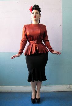 "The fanciest of all peplum blouses. A great copper color.. kinda changes but it may have a tiny darker discoloration under the armpit. But it's barely noticeable. Buttons up all the way up the back. Measures Bust: 34\" Waist: 28\"" Fitted Long Sleeve Peplum Top For Party, Elegant Peplum Blouse For Fall, Vintage Brown Ruffled Tops, Vintage Brown Tops With Ruffles, Vintage Brown Top With Ruffles, Brown Fitted Top For Evening, Fitted Evening Peplum Top, Evening Fitted Peplum Top, Fitted Peplum Top For Evening