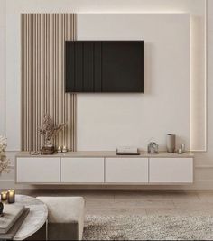 a living room with a television on the wall