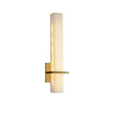 a wall light that is on the side of a white wall with a gold frame