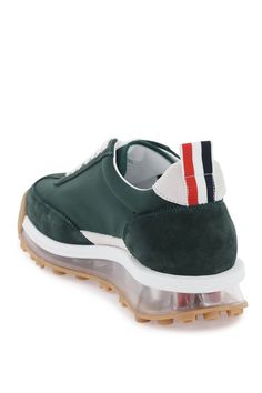 Tech Runner sneakers by Thom Browne crafted in nylon with tone-on-tone suede inserts. Lace-up closure, logo patch on tongue, leather interior with removable insole and tricolor grosgrain loop tab on heel. Clear rubber sole with tricolor inserts. Size Info US Color Detail Green Made In Italia Material 100% calf leather*** 100% PA Season One fall Season Two winter Product shoes Brand Thom Browne Size And Fit Heel Height = 3 cm Thom Browne Shoes, Latest Fashion Design, Designer Belt, Sneaker Games, Diaper Backpack, Sporty Look, Pump Sandals, Thom Browne, Sneakers For Sale