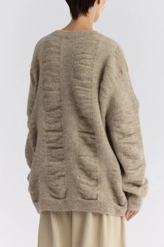 Waterfall Sweater in Natural designed by Black Crane. A relaxed sweater with dropped shoulders. Soft and lightweight. Sizing + Details → Made In Japan 67% Japanese Mohair, 17% Nylon, 16% Wool Runs Large Dry Clean Model Stands 5'8" And Wears S (Chest 32", Waist 28", Hip 35.5")