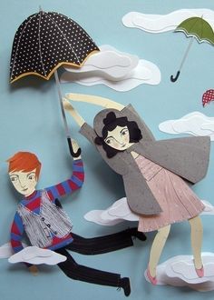 paper cut art depicting two people holding umbrellas