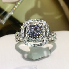 a fancy diamond ring on display at a jewelery store